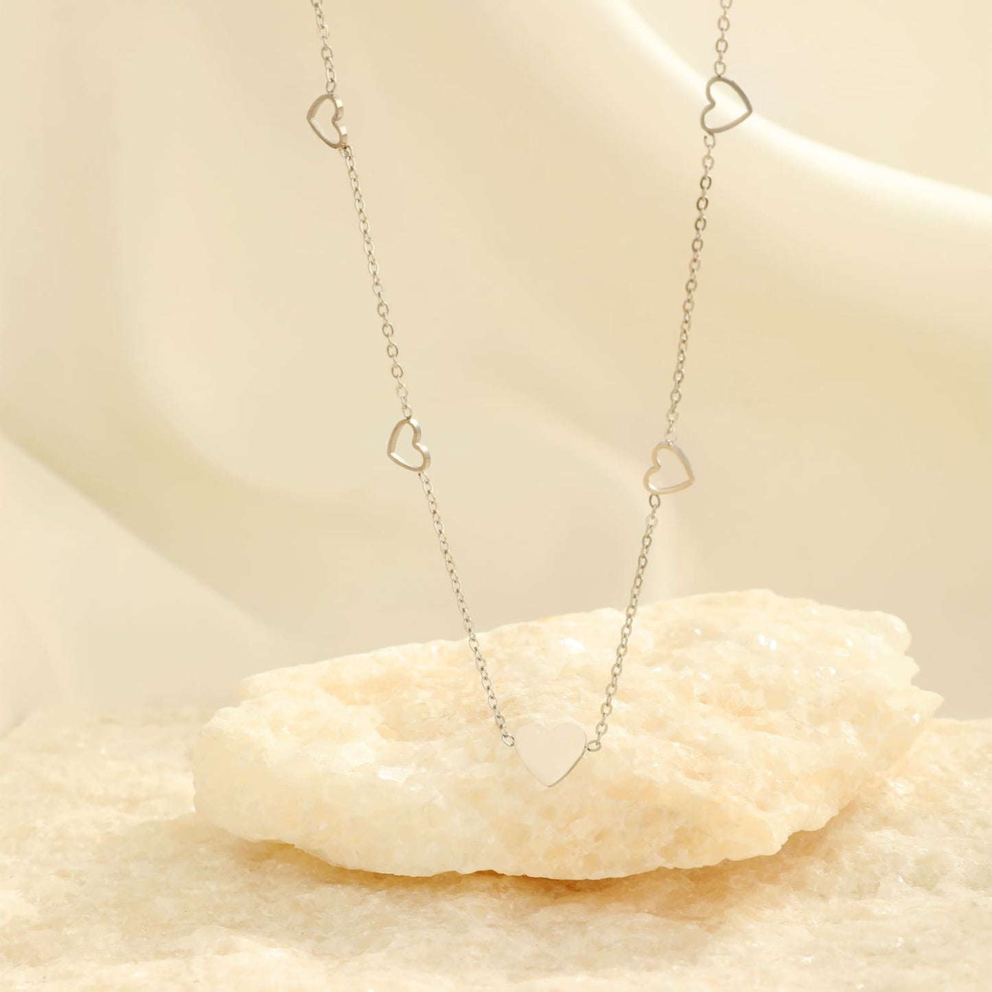 "VIER OPEN HARTJES" ZILVEREN KETTING